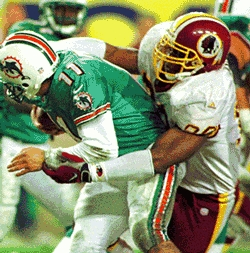 Redskins All-Pro D'Aundré Banks sacks an opponent during a 1999 game.